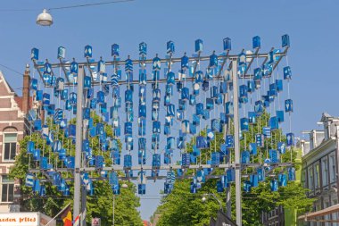 Amsterdam, Netherlands - May 15, 2018: Sign Structure at Entrance to Albert Cuyp Open Market at Albert Cuypstraat Street Sunny Spring Day. clipart