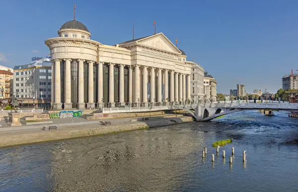 Stock image Skopje, North Macedonia - October 23, 2023: Archaeological Museum Building at Vardar River in Capital City Centre Sunny Autumn Day.