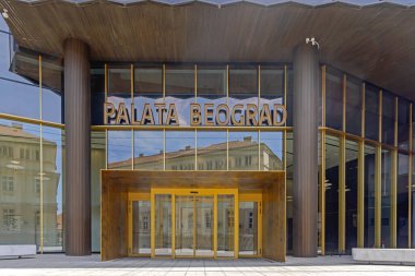 Belgrade, Serbia - May 11, 2024: Entrance to Palace Belgrade Famous Skysraper Beogradjanka at Masarikova Street in Capital City Spring Day. clipart