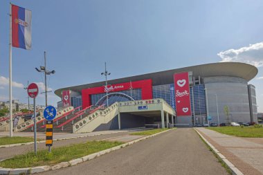 Belgrade, Serbia - June 19, 2023: Modern Sports Facility Basketball Tournaments Conventions and Live Music Events Stark Arena at Sunny Summer Day in Capital City. clipart