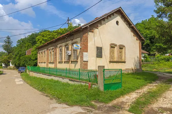 stock image Lenovac, Serbia - June 12, 2022: Post Office at Old School Building in Village at Sunny Spring Day.