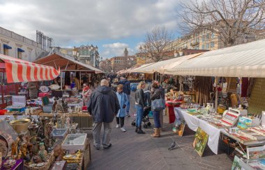 Nice, France - January 29, 2018: People Walking at Brocante Antique Market Cours Saleya Old Town Winter Day. clipart