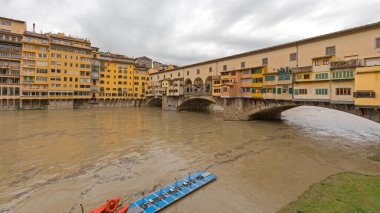 Florence, Italy - February 2, 2018: Ponte Vecchio Historic Bridge Landmark Over Arno River at Winter Day. clipart