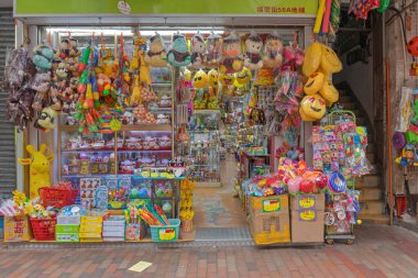 Hong Kong, China - April 24, 2017: Variety of Toys Plush and Plastic Toy Shop at Fuk Wing Street Un Chau. clipart