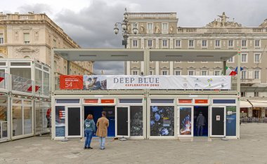 Trieste, Italy - October 08, 2024: Expo Booth Deep Blue Exploration Zone Schmidt WWF Organization at Main Square During Barcolana Sailing Race. clipart