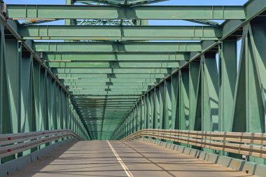 Green Steel Road Bridge Over River Sava at Sunny Spring Day clipart