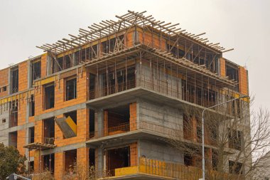 Rebar Concrete and Blocks Scaffolding at Residential Building Construction Site in Town clipart