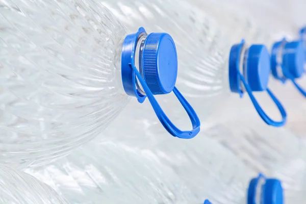 stock image Water in plastic bottles on a white background, isolated