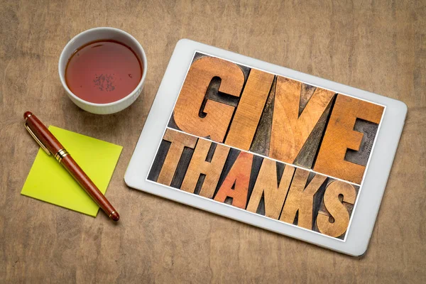 Give Thanks Word Abstract Letterpress Wood Type Digital Tablet Cup Stock Photo