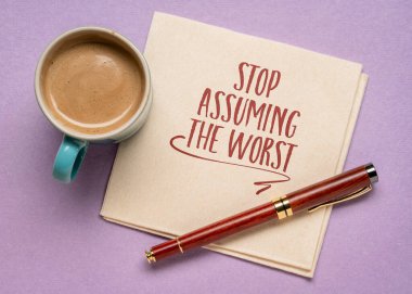 stop assuming the worst inspirational note or advice on a napkin with a cup of coffee, positive mindset concept clipart