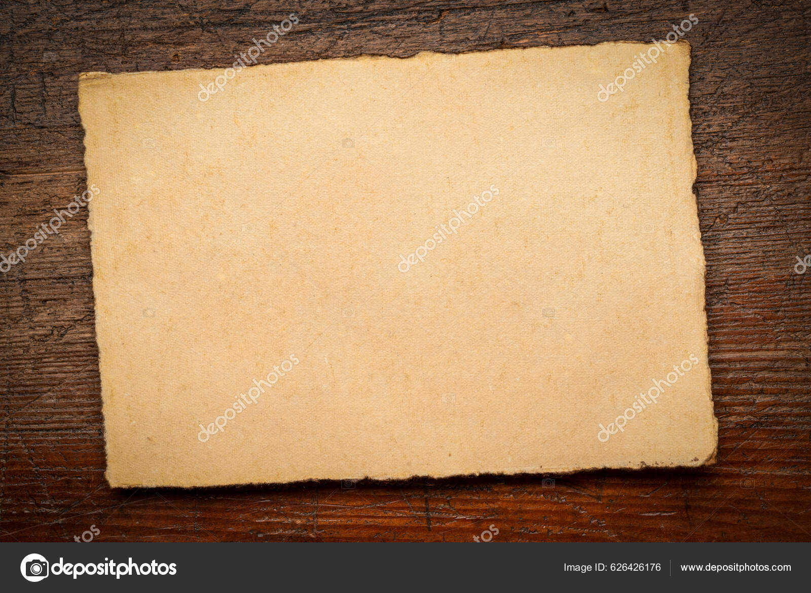 Isolated Stack Of Tan Toned Deckle Edge Paper Sheets Stock Photo