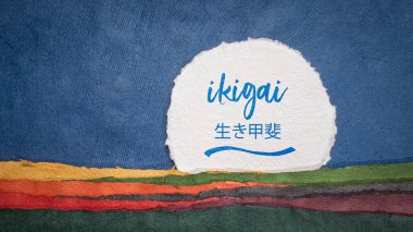 ikigai - Japanese philosophy and life style  - a reason for being or a reason to wake up  - handwritten note in an abstract paper landscape clipart