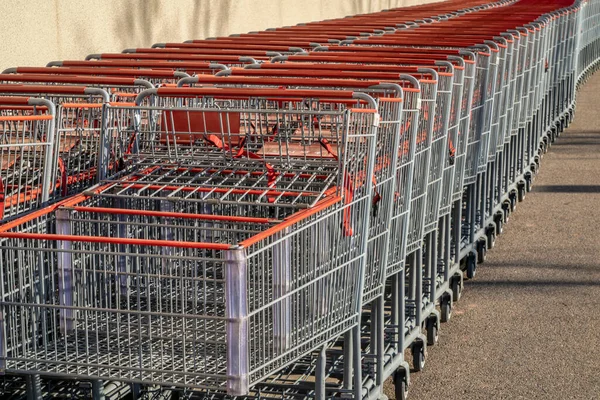 Store Shopping Carts Lined Row Together Wall Store — Stock Photo, Image