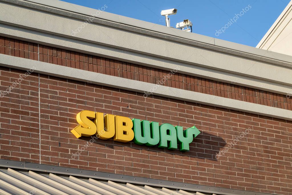 Fort Collins, CO, USA - April 26. 2023: Subway sign on the building facade. Subway is an American fast food restaurant chain that specializes in sandwiches.