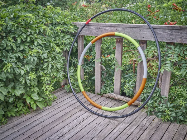 Weighted Hula Hoop One Home Made Sprinkler Pipe Wooden Backyard — Stock Photo, Image