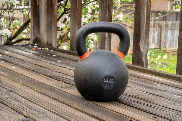 Heavy Iron Competition Kettlebell Weight Training Wooden Grunge Deck Home — Stock Photo, Image