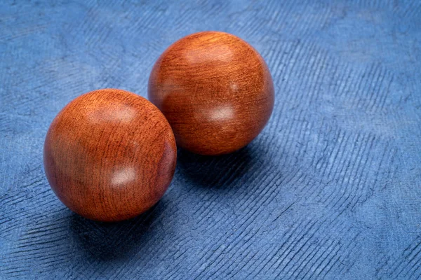 Pair Wooden Chinese Medicine Balls Textured Paper — Stock Photo, Image