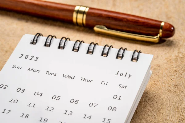 July 2023 Closeup Small Desktop Calendar Pen Time Business Concept — 스톡 사진