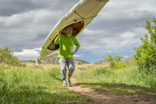 Senior Male Portaging Decked Expedition Canoe Foothills Northern Colorado Spring — Stock Photo, Image