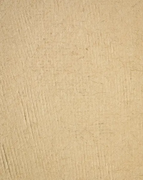 background of beige handmade textured paper crafted in Mexico