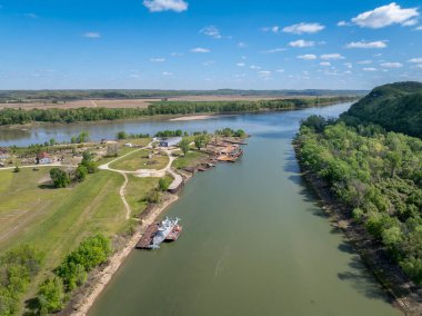 Gasconade River at confluence with the Missouri River, springtime aerial view with an old boatyard and barges clipart