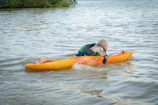 stock image Loveland, CO, USA - June 16, 2024: Paddling Bellyak, a prone kayak on Boyd Lake in Colorado, water recreation which combines the best aspects of kayaking and swimming.