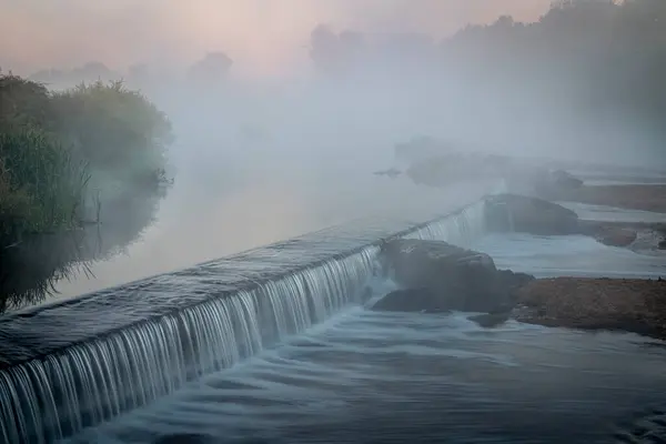 stock image Morning fog over a river diversion dam - South Platte River below Denver in northern Colorado