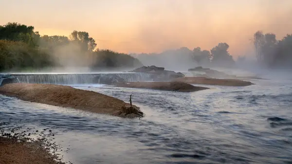 Stock image Morning fog over a river diversion dam - South Platte River below Denver in northern Colorado