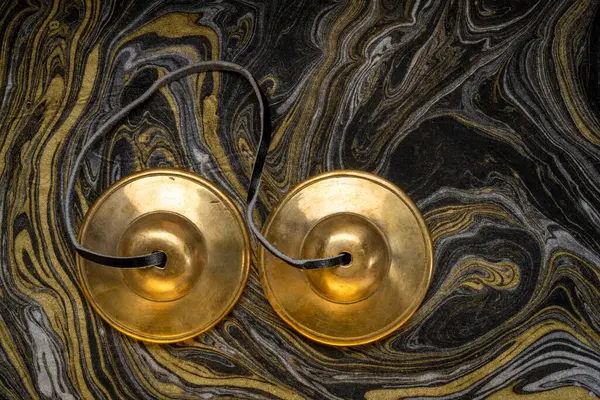 stock image tingsha cymbals used in the Tibetan religion in prayers, rituals, meditation, and healing