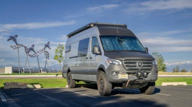 Loveland, CO, USA - August 24, 2024: 4x4 camper van built on Mercedes Sprinter chassis. clipart