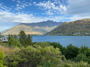 Photo of Lake Wakatipu as viewed from Frankton Beach, Queenstown in the Otago region of the South Island in New Zealand. clipart