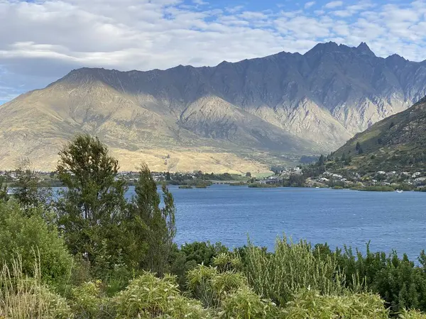 stock image Photo of Lake Wakatipu as viewed from Frankton Beach, Queenstown in the Otago region of the South Island in New Zealand.