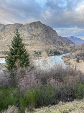 Photo of the Shotover River Kimiakau with Mount Aspiring viewed from Arthurs Point in Queenstown, Otago, South Island New Zealand. clipart