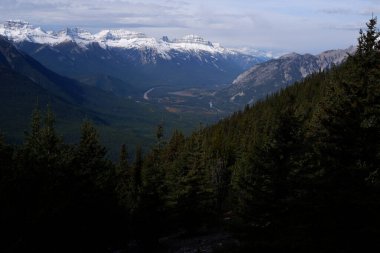 Photo of the Bow Valley, Bow River, Lake Minnewanka, Tunnel Mountain and Mount Rundle within Banff National Park in Alberta, Canada. clipart