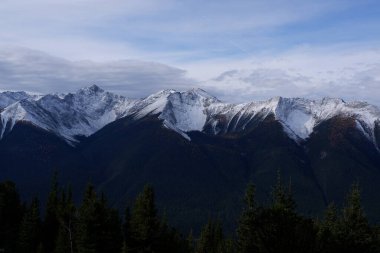 Photo of the Sundance Range in the Canadian Rockies within Banff National Park in Alberta, Canada. clipart