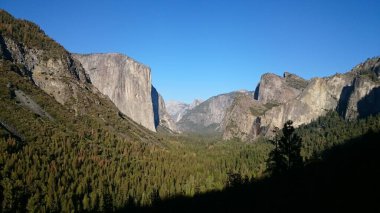 Photo oh the Wawona Tunnel View of Yosemite Valley, El Capitan, Bridalveil Fall in Yosemite National Park, California USA . clipart