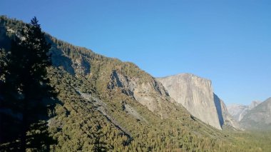 Photo oh the Wawona Tunnel View of Yosemite Valley, El Capitan, Bridalveil Fall in Yosemite National Park, California USA . clipart