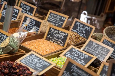 Spices in a french market with signs, landscape view