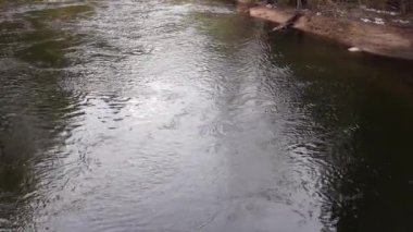 Looking Down On Merced River Flowing Towards Camera With Surface Patterns On Water
