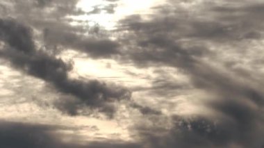 Handheld Camera Movement Down Through Clouds To Ocean Near Sunset