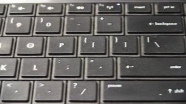 Camera Moving From Right To Left Viewing Laptop Keyboard