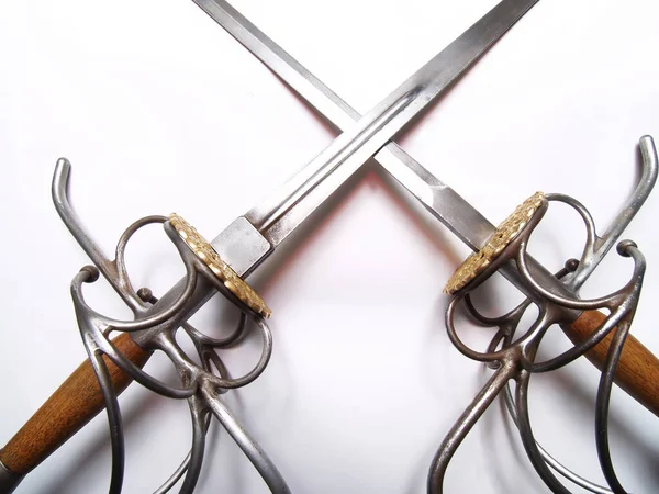 stock image Crossed Blades Sword And Dagger With Hilts And Wooden Pommel On White Background