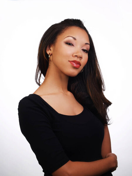 Slim Pretty African American Woman In Black Dress Looking At Camera On White Background