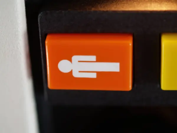 Tight Shot Orange White Flight Attendant Call Button Commercial Aircraft Стокове Фото