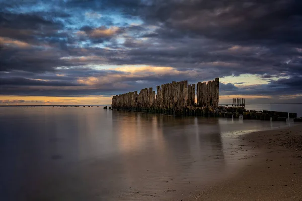 Old Pier Remains Baltic Sea Wooden Posts Smooth Water Dusk — Stock Photo, Image