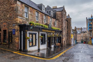 Edinburgh, Scotland, UK - May 8, 2023 - Greyfriars Bobby Bar, historic pub at 34 Candlemaker Row, famous for a legend of a dog known as Bobby. clipart