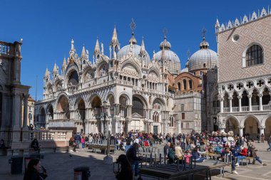 Venice, Italy - March 24, 2024 - St. Mark Basilica (Basilica di San Marco) and tourists on St. Mark's Square - Piazza San Marco. clipart