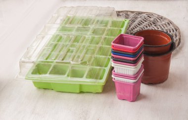 Mini Greenhouse pots and minipots for seedlings on the table. Preparing for spring work