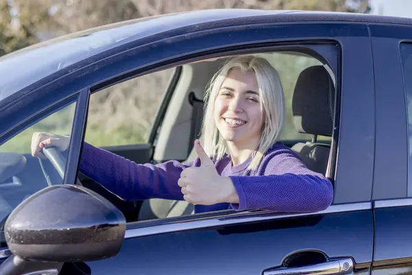 Smiling Woman Car Giving Thumbs Possibly Indicating Good Driving Experience Stockfoto