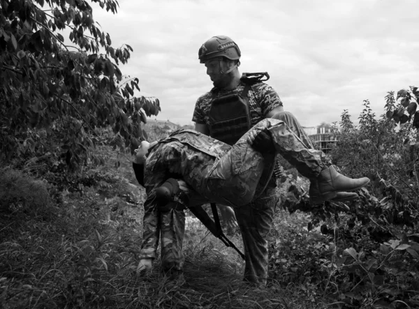 stock image Brave USA nato navy force unit armed guard male guy hand gun shot hurt protect hope pray blood pain ptsd danger life fight fire dark forest tree field. Human aid prayer young girl hero stress concept